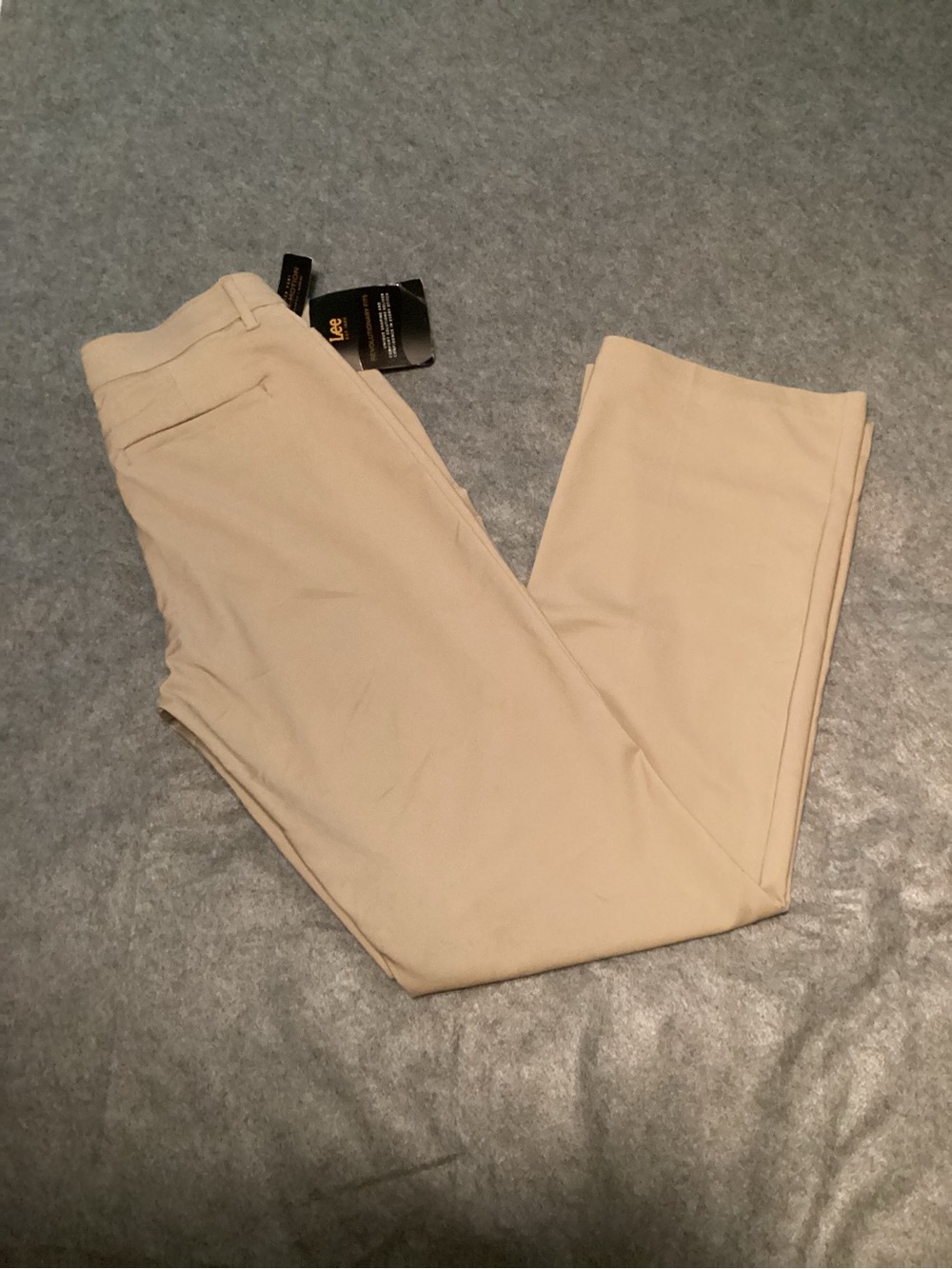 C42. Lee woman’s 10 long, Khaki Regular Fit mid rise flex Motion waist band.